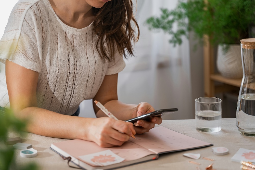 woman writing a to-do list